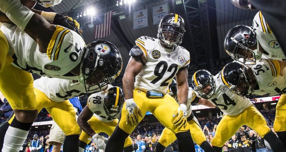 James Harrison #92 leads the Steelers in a pre-game pep talk ahead of playing the Detroit Lions