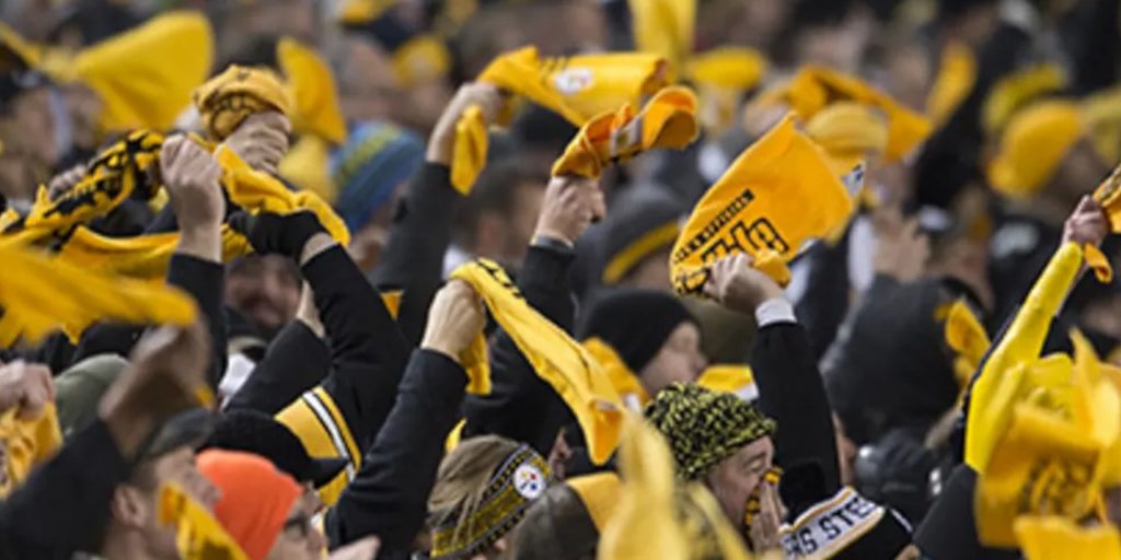 Pittsburgh Steelers fans wave their cherished 'Terrible Towels' at Heinz Field during an NFL playoff game