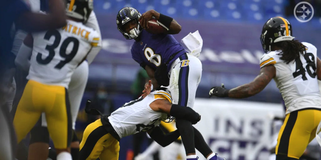 Cameron Sutton of the Pittsburgh Steelers tackles Lamar Jackson of the Ravens