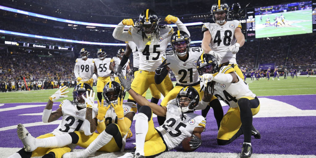 Ahkello Witherspoon (25) celebrates with Steelers teammates