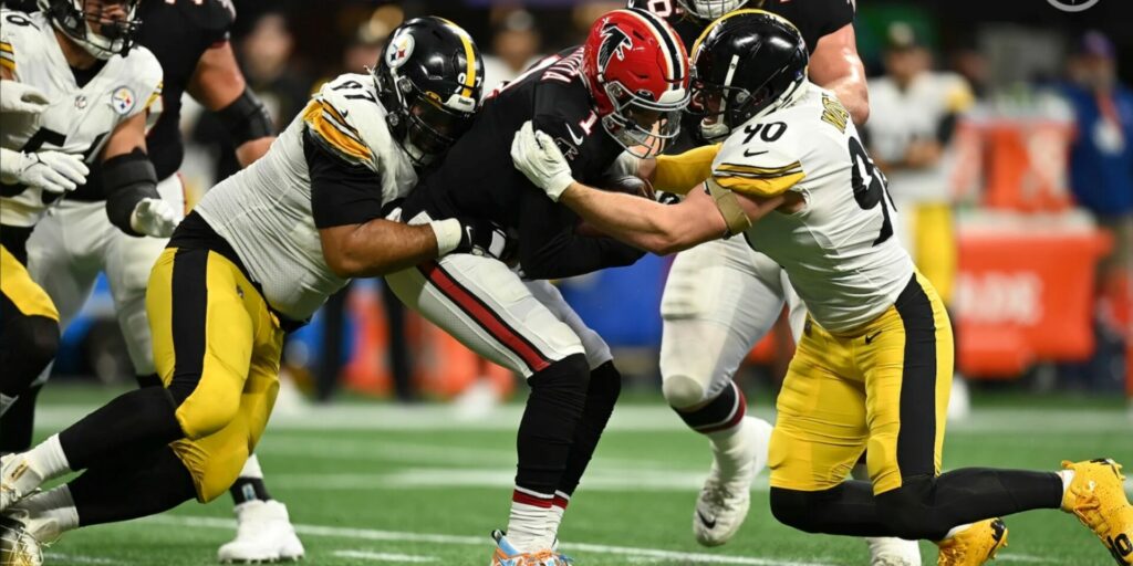 Cam Heyward (97) and T.J. Watt (90) of the Pittsburgh Steelers