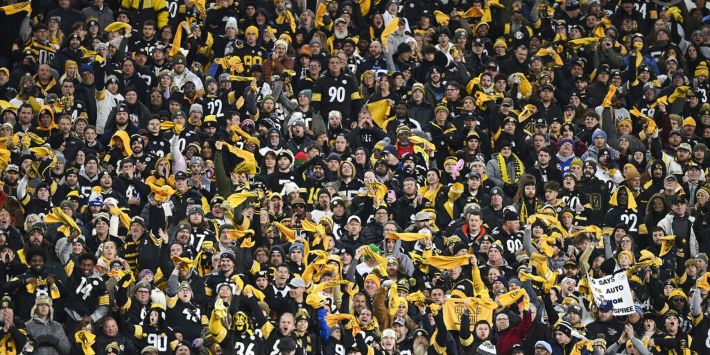 Pittsburgh Steelers fans wave their cherished 'Terrible Towels' at Heinz Field during an NFL playoff game