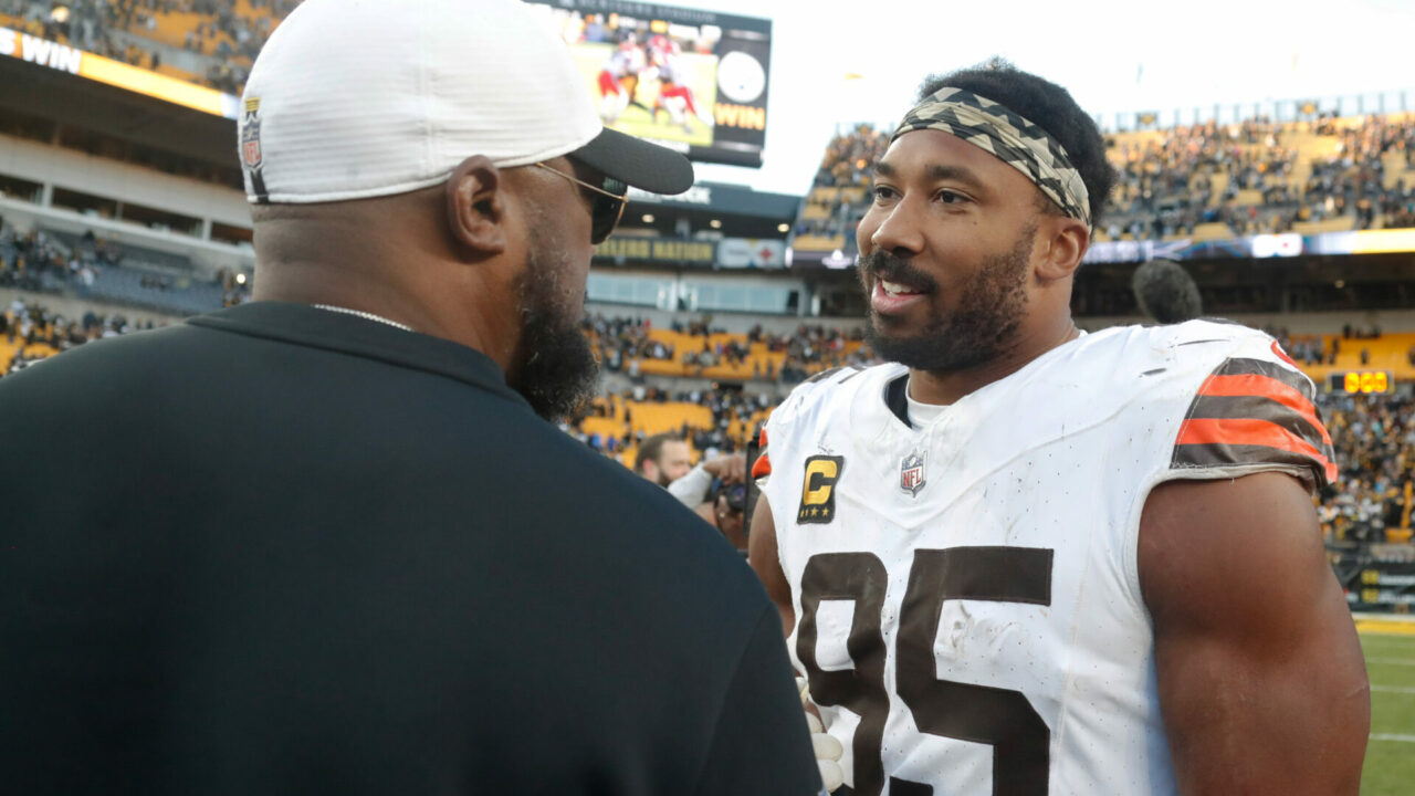 Pittsburgh Steelers head coach Mike Tomlin (left) and Cleveland Browns defensive end Myles Garrett (95)