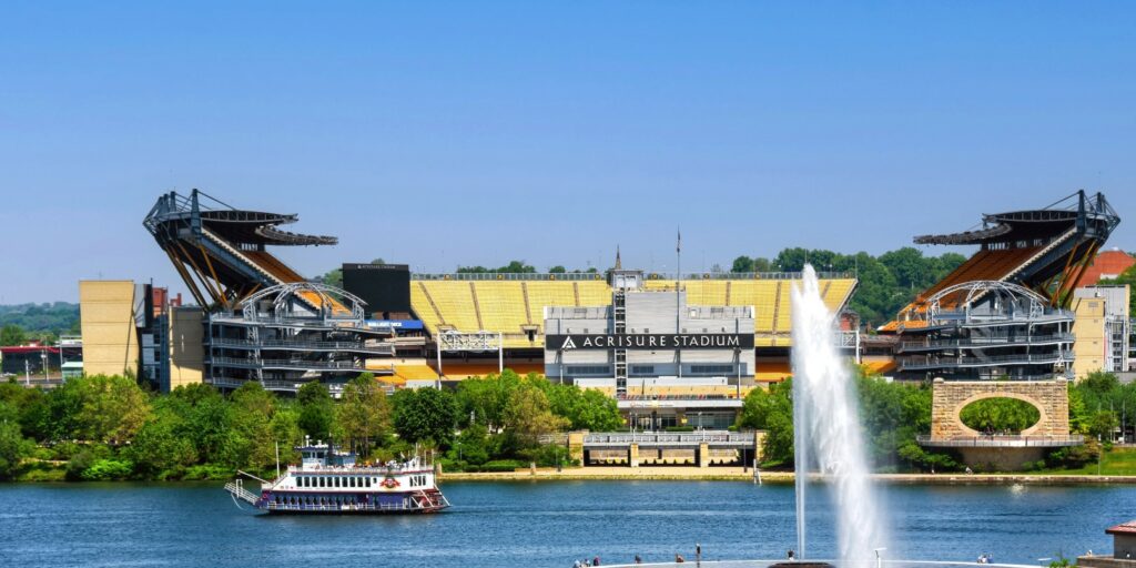 Riverboat cruise ship Princess passes between Acrisure Stadium, home of the Pittsburgh Steelers